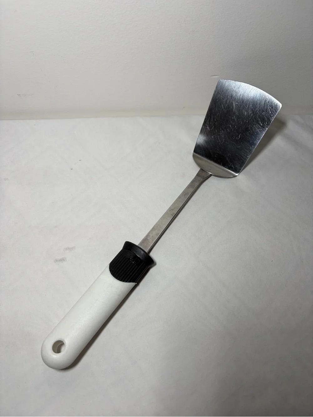 Stainless Steel Turner Spatula with White Handle and Black Grip - EKCO